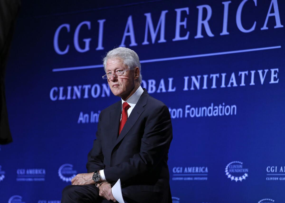 Interviewed at an annual meeting of his philanthropic organization, former President Bill Clinton defended his wife's comment about the couple's wealth, saying Hillary Rodham Clinton is "not out of touch" with average Americans.