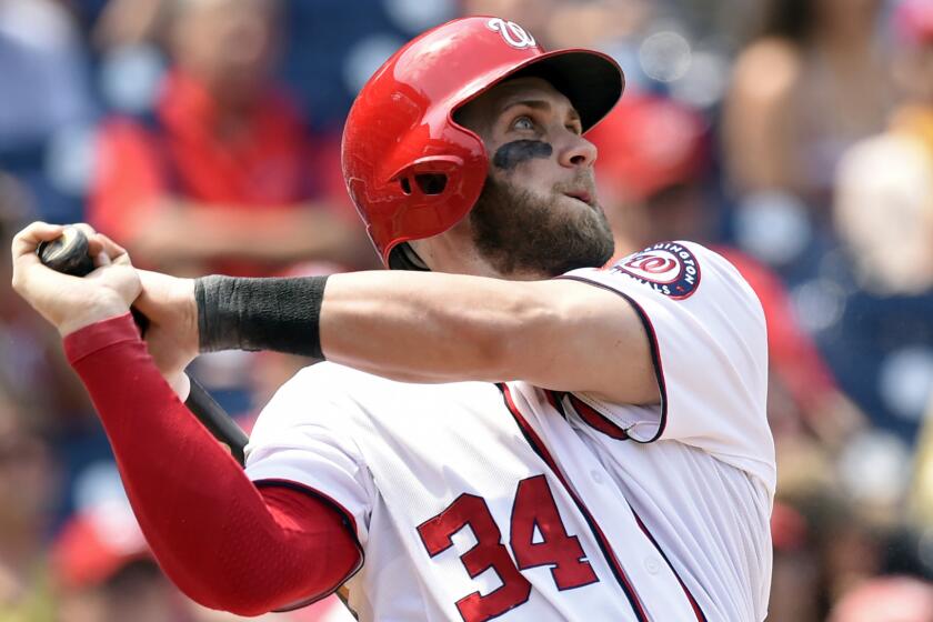 Washington Nationals right fielder Bryce Harper hits a home run against the Miami Marlins on Wednesday.