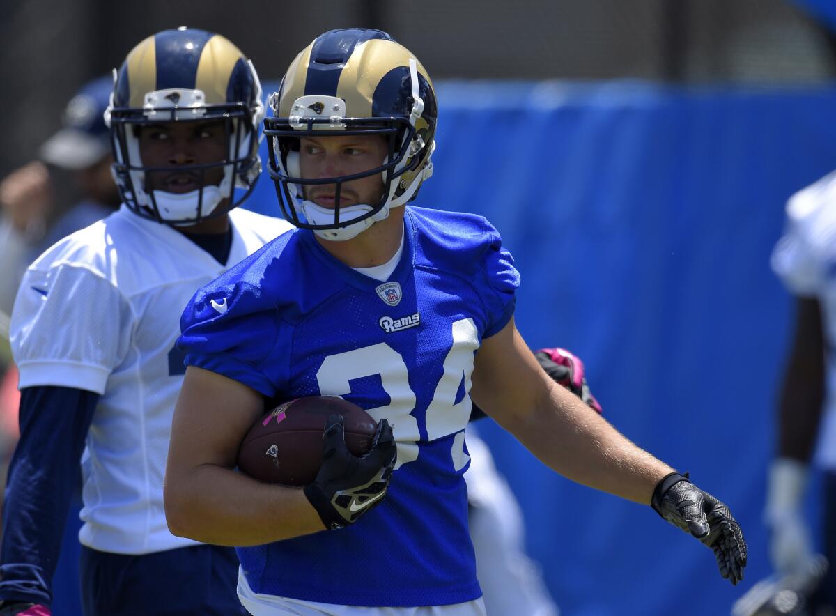 Los Angeles Rams running back Chase Reynolds runs the ball during NFL football practice this month in Oxnard, Calif. It was announced Thursday that BS-TV Channel 2 will be the official TV home to preseason Rams games.