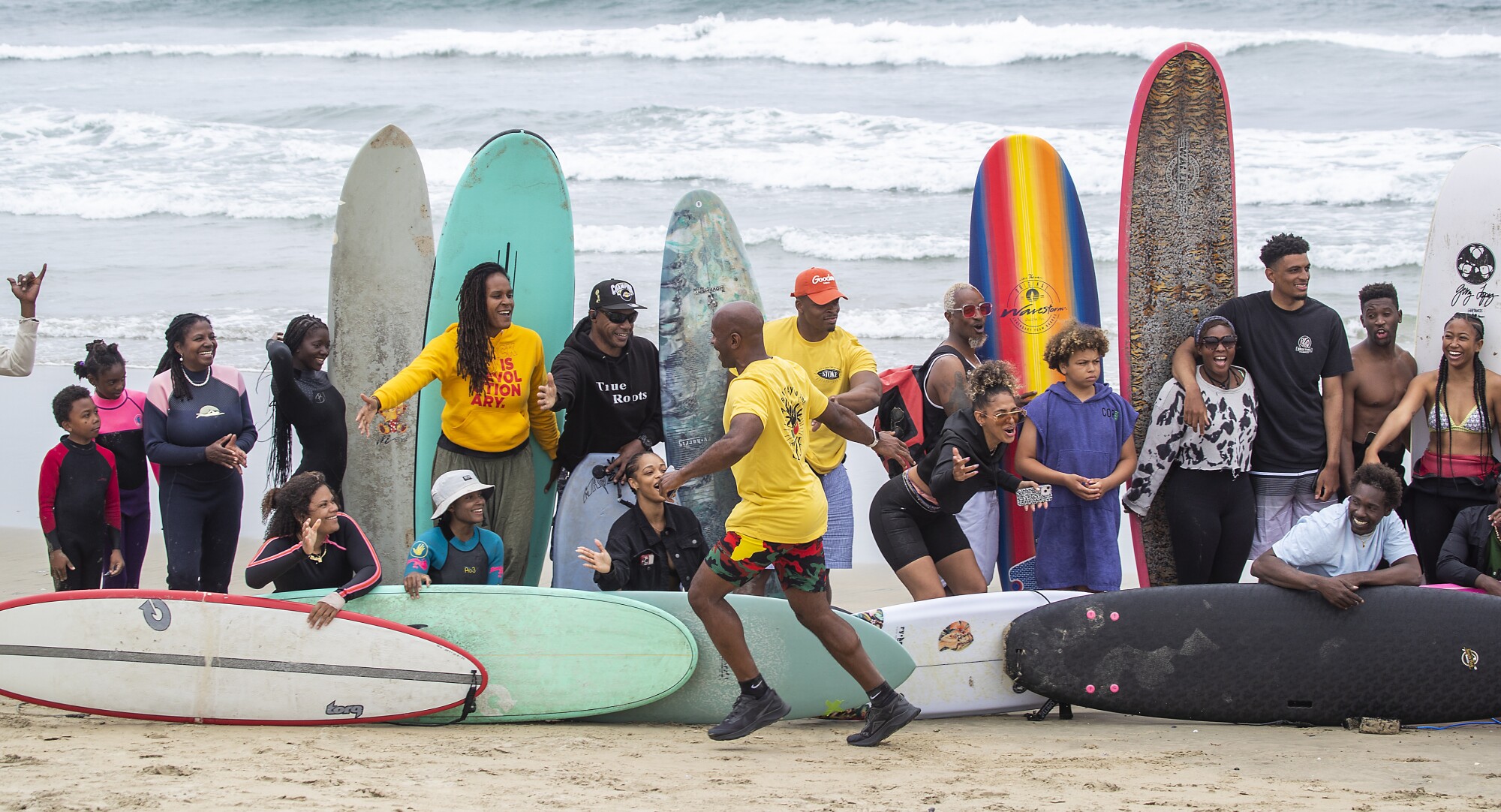 Surfers line up for a group photo