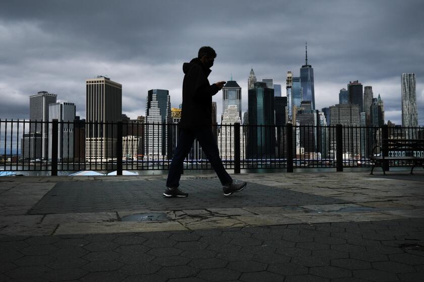 NEW YORK, NY – APRIL 04: The Manhattan skyline stands in the distance as people try to get some time outside in Brooklyn on April 04, 2020 in New York City. Hospitals in New York City, which has been especially hard hit by the coronavirus, are facing shortages of beds, ventilators and protective equipment for medical staff. Currently, over 75, 000 New Yorkers have tested positive for COVID-19 (Photo by Spencer Platt/Getty Images)
