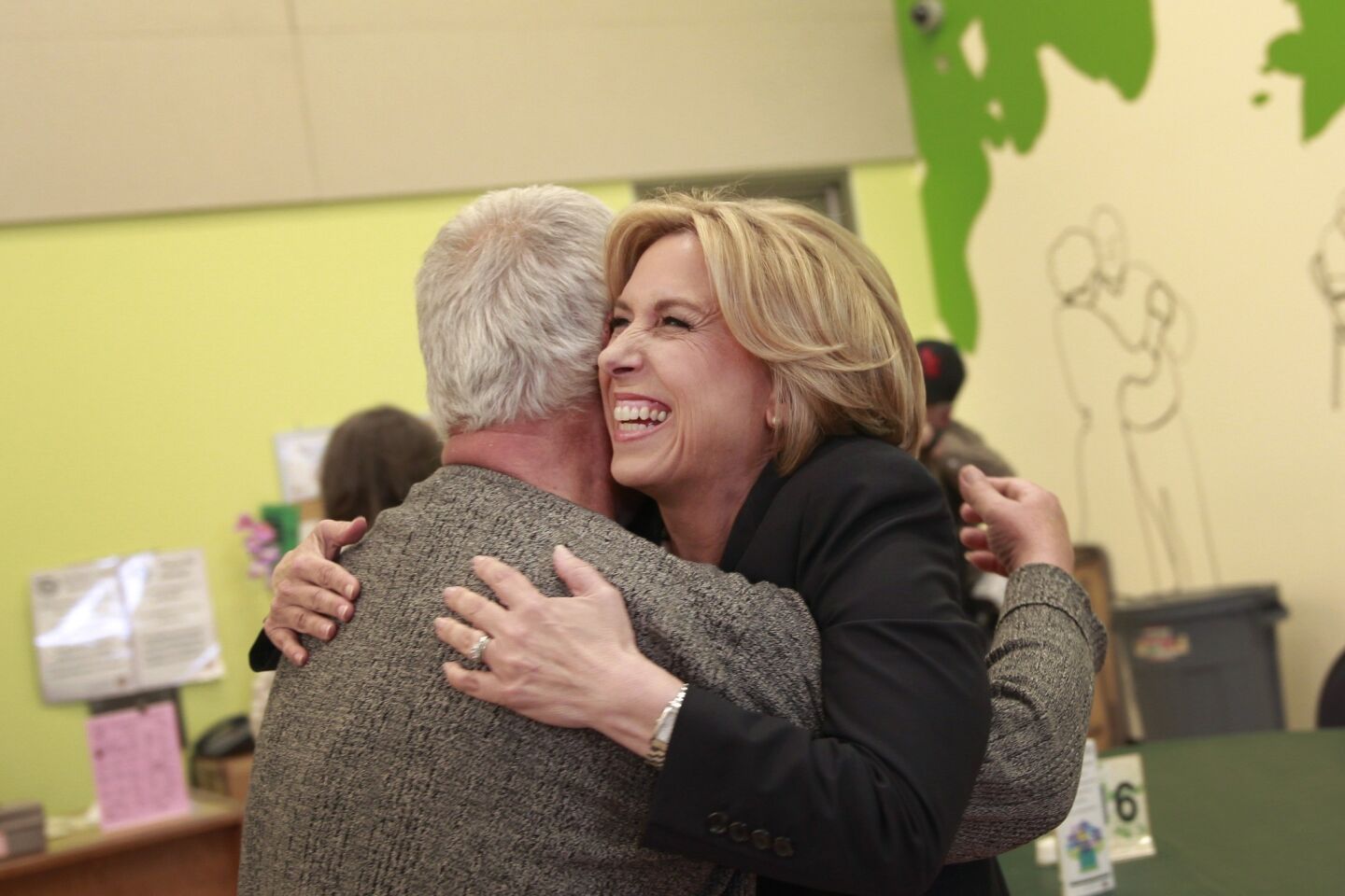 Mayoral candidate Wendy Greuel gets a hug during a campaign stop at the Sherman Oaks/East Valley Adult Center.