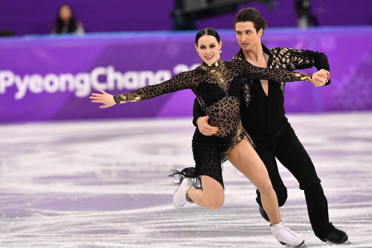 Canada's Tessa Virtue and Canada's Scott Moir compete in the ice dance short dance.