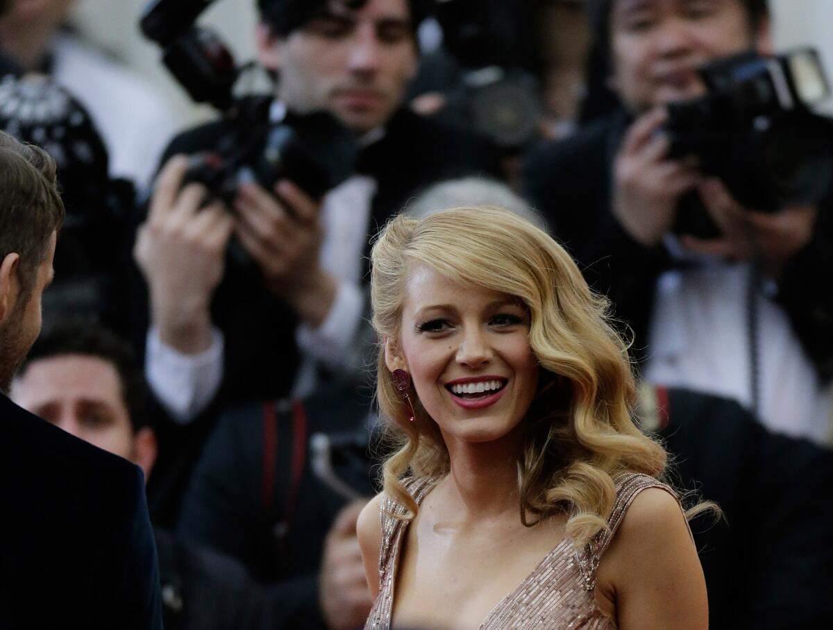 Blake Lively, seen here at the Costume Institute Gala at New York's Metropolitan Museum of Art in May, is on the August 2014 cover of Vogue.