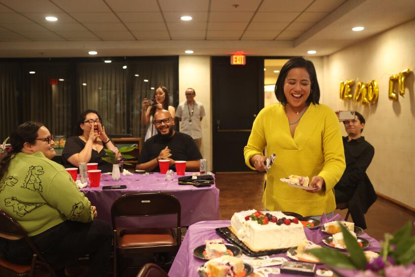 Los Angeles, CA - March 16: Ysabel Jurado cuts a cake during a celebration of her campaign heading into a runoff at Tokyo Villa Homeowners Associates on Saturday, March 16, 2024 in Los Angeles, CA. (Michael Blackshire / Los Angeles Times)