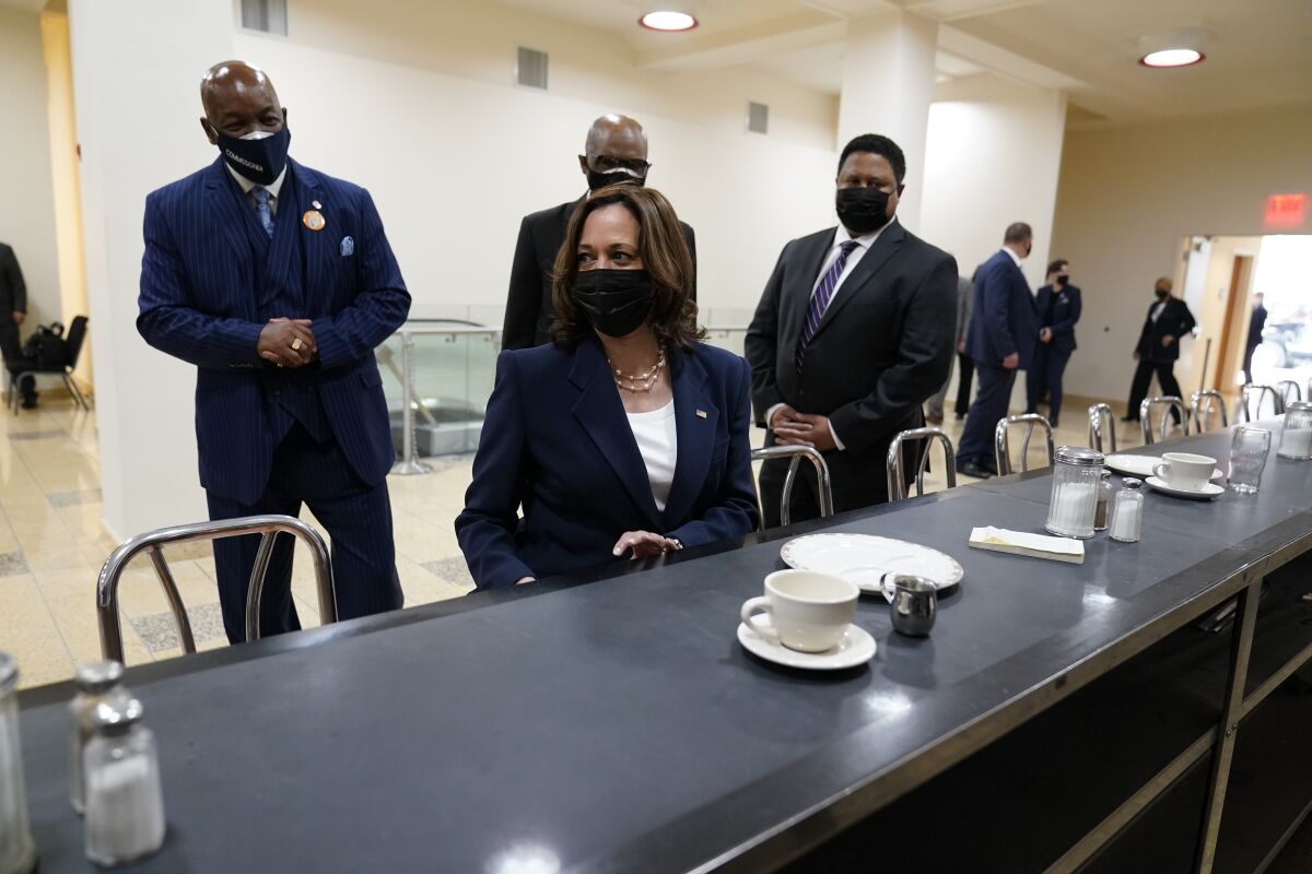 Vice President Kamala Harris sits at the former Woolworth's "whites only" lunch counter in Greensboro, N.C. on Monday.