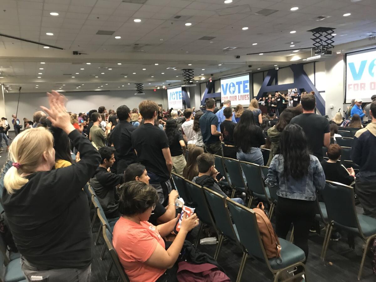 The crowd at a "Vote for Our Lives" rally Sunday afternoon at UC Irvine gives a standing ovation to student activists from Parkland, Fla.
