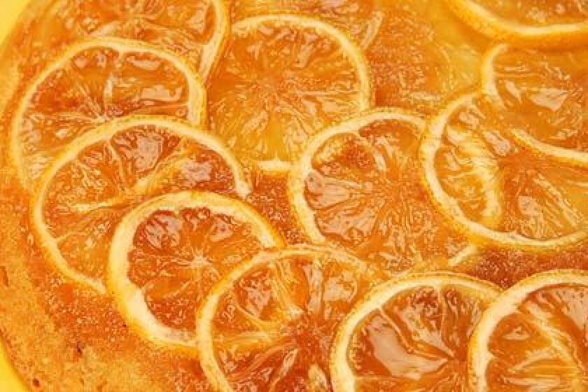 JAMMY RICHNESS: A marmalade-like top (or is it bottom?) with overlapping fruit slices is a beautiful part of this lemon upside-down cake.