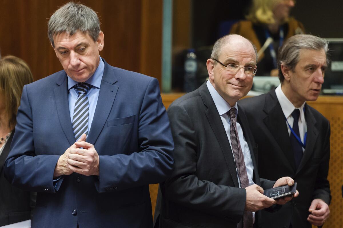 Belgian Justice Minister Koen Geens, center, in 2016. 