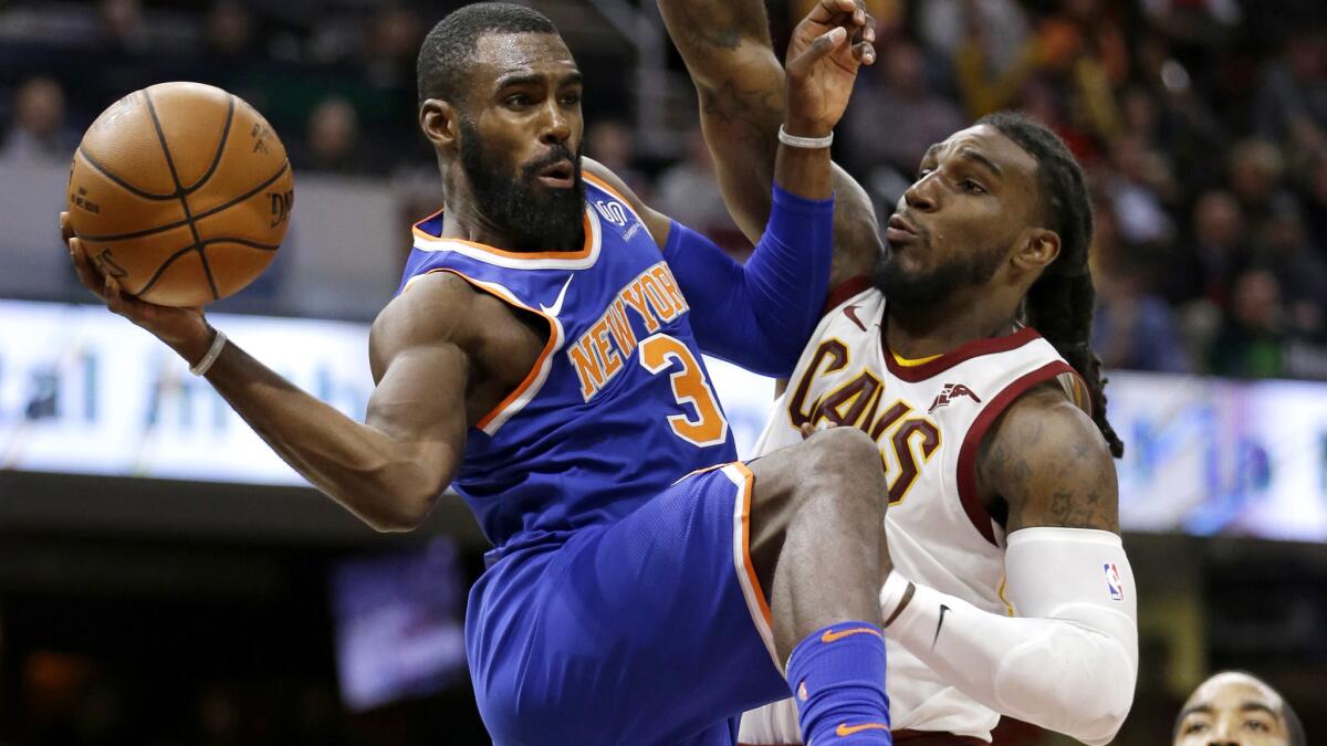 Knicks guard Tim Hardaway Jr., left, passes around Cavaliers forward Jae Crowder during the second half Sunday.