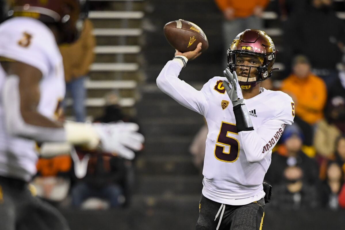 FILE - Arizona State quarterback Jayden Daniels (5) passes to running back Rachaad White (3) during the first quarter of an NCAA college football game Nov. 20, 2021, in Corvallis, Ore. Former Arizona State quarterback Daniels is transferring to LSU, where he will enter a wide open competition to be the starter in coach Brian Kelly’s first season with the Tigers. (AP Photo/Andy Nelson, File)