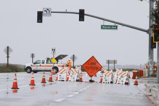 Huntington Beach, CA - February 5, 2024: The Southbound lanes of Pacific Coast Highway from Warner Avenue to Seapointe Street remain closed due to flooding in Huntington Beach on Feb. 5, 2024.(Allen J. Schaben / Los Angeles Times)