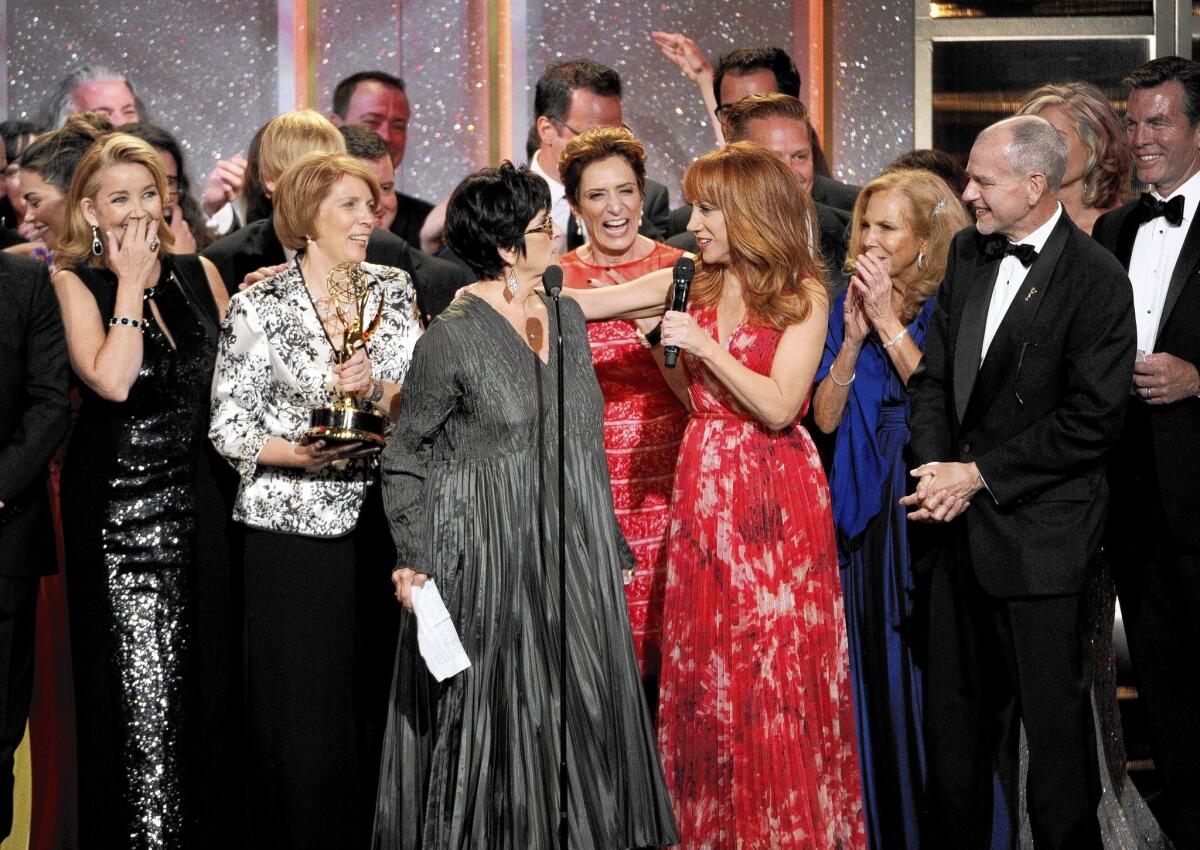 The crew of “The Young and the Restless” accepts the award for outstanding drama series at the 41st annual Daytime Emmy Awards at the Beverly Hilton Hotel on June 22, 2014, in Beverly Hills.