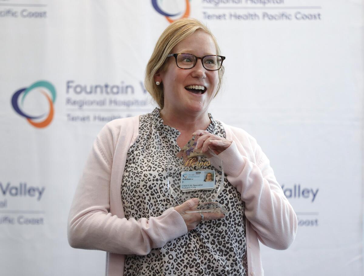 Adrienne Feilden is overwhelmed as she is recognized with a surprise party for receiving the 2022 Tenet Health Hero award.