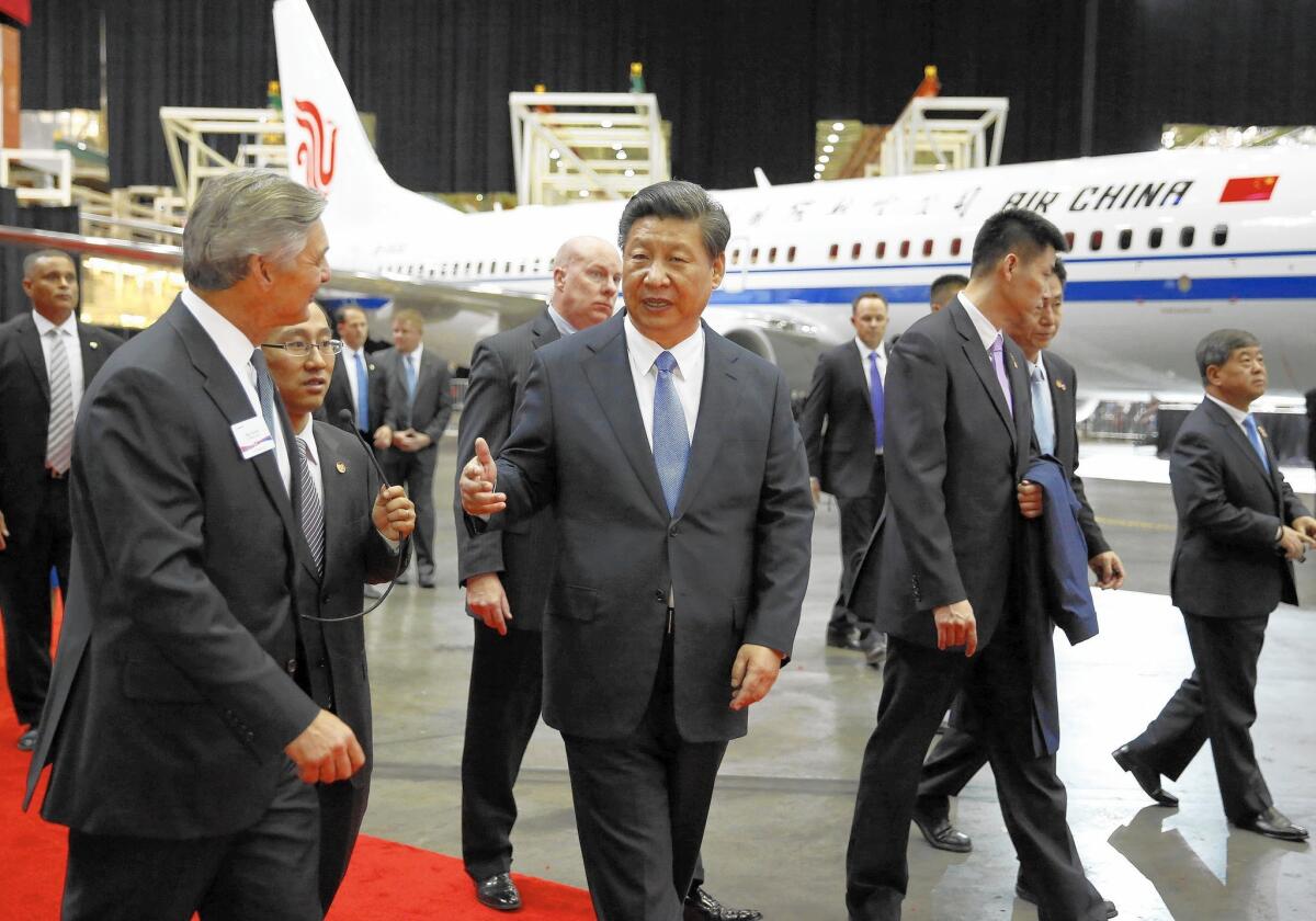 Chinese President Xi Jinping tours a Boeing plant in Washington state.