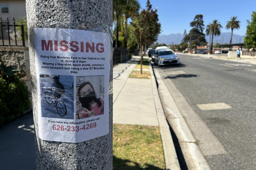 A sign posted in Monterey Park seeks information about the whereabouts of Alison Chao.