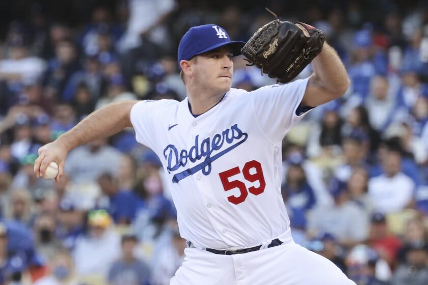 Los Angeles, CA - October 19: Los Angeles Dodgers pitcher Evan Phillips delivers a pitch during the sixth inning in game three in the 2021 National League Championship Series against the Atlanta Braves at Dodger Stadium on Tuesday, Oct. 19, 2021 in Los Angeles, CA. (Robert Gauthier / Los Angeles Times)