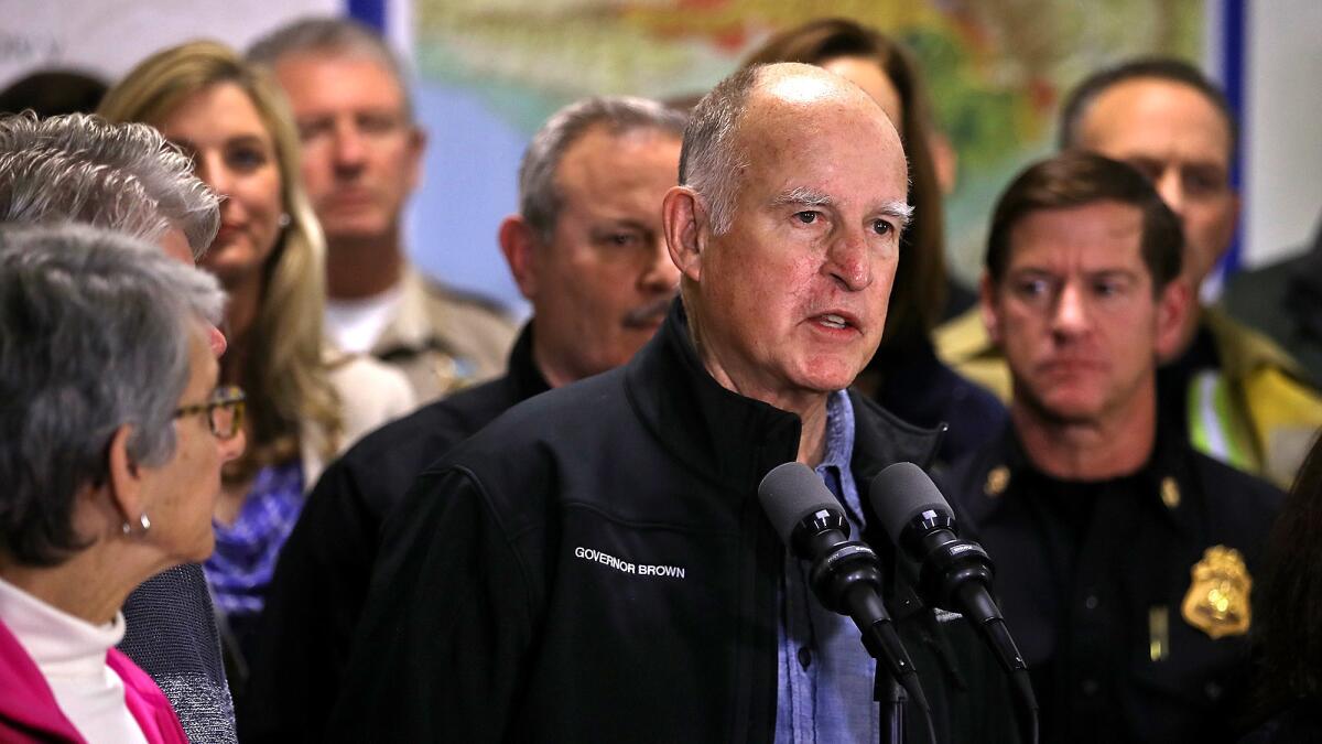 Gov. Jerry Brown speaks about the Southern California wildfires during a news conference at the Ventura County Fairgrounds.