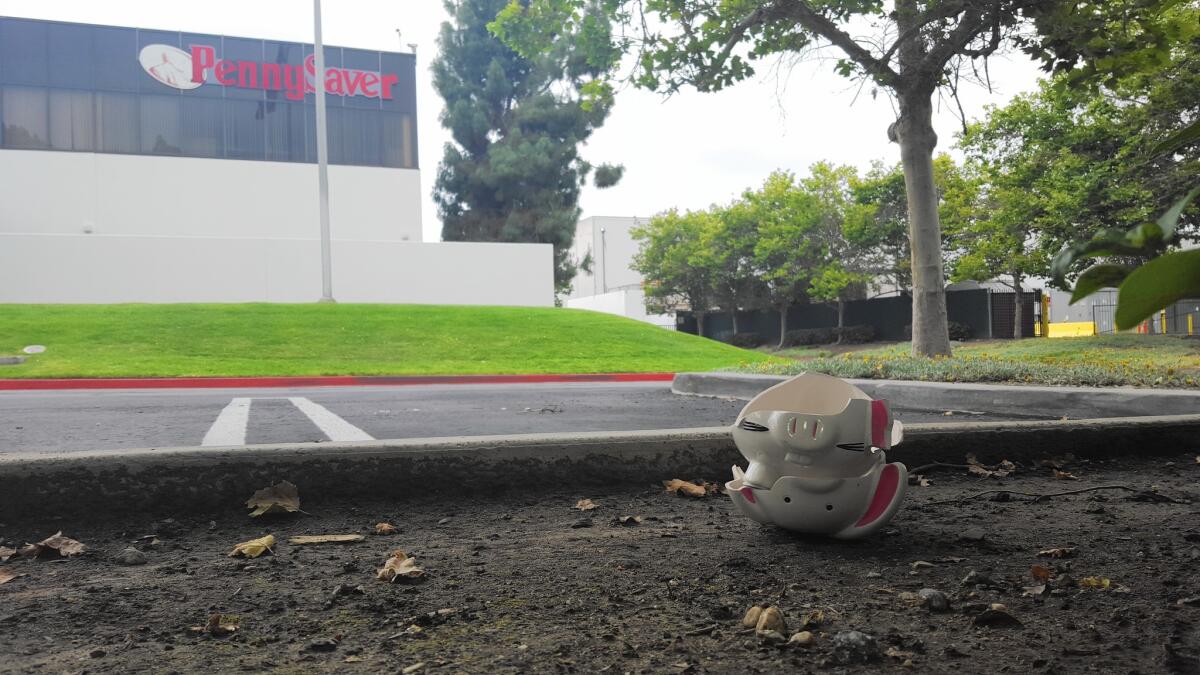 A few days after hundreds of PennySaver employees lost their jobs, a broken piggy bank was seen near the parking lot.