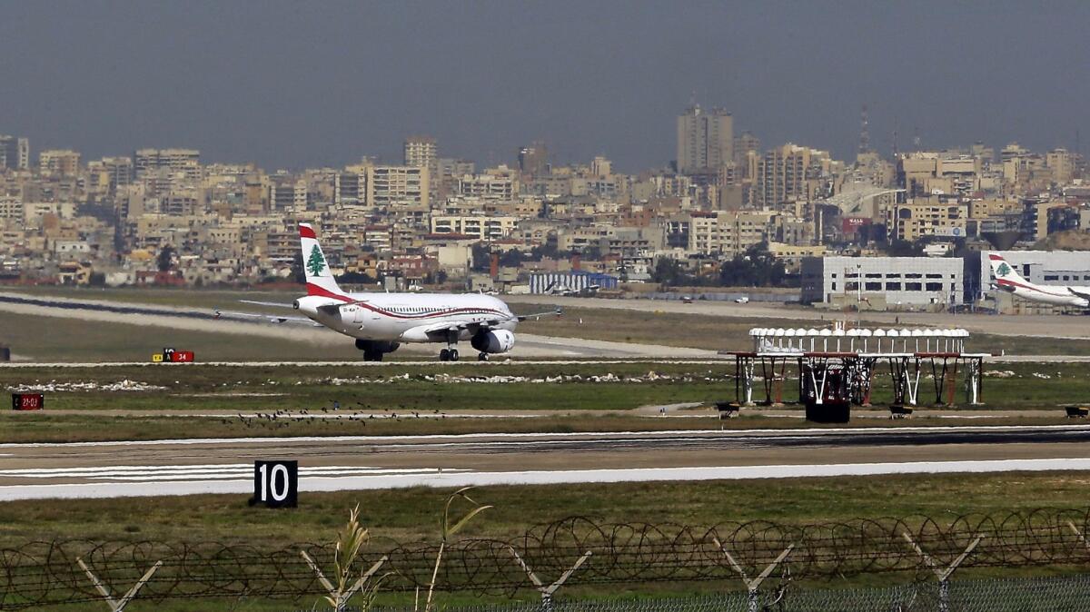 A general view shows a flock of birds (foreground) near the runway as a Middle-East airlines plane taxis at Beirut International airport in the Lebanese capital on Jan. 12, 2017.