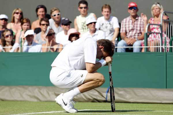 Nicolas Mahut reacts during his first round match against John Isner on Day Three of the Wimbledon Tennis Championships on June 23, 2010.