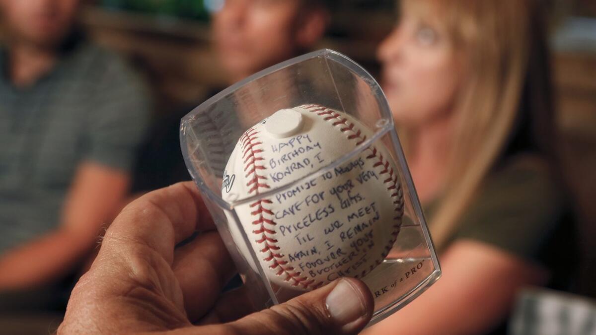 Rod Carew left a signed baseball with a message for Reuland and his family on Konrad Reuland's grave.