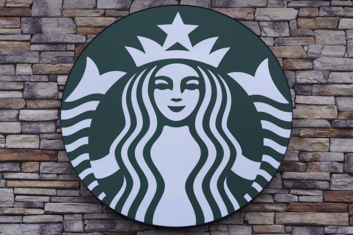 A Starbucks mermaid logo sign 