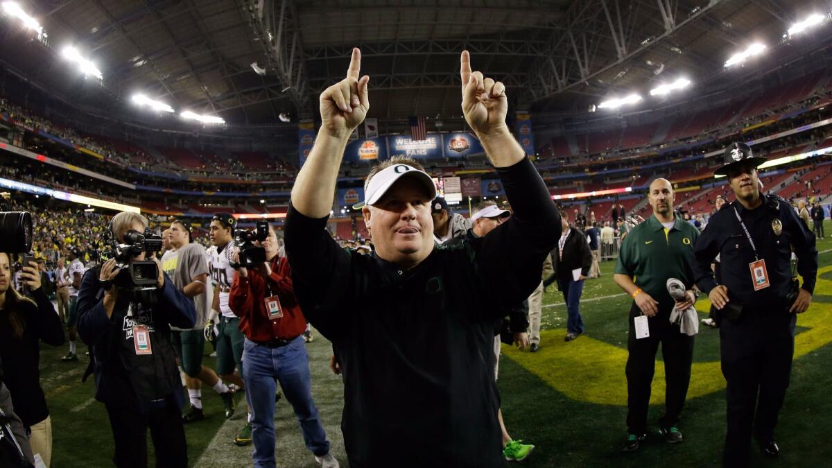 Then-Oregon head coach Chip Kelly celebrates after the Ducks beat the Kansas State Wildcats, 35-17, in the Tostitos Fiesta Bowl at University of Phoenix Stadium on Jan. 3, 2013.