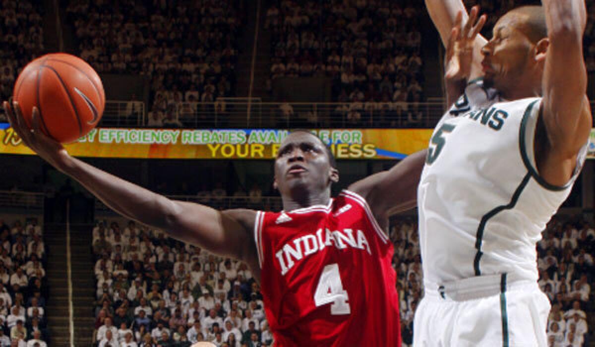 Indiana's Victor Oladipo drives to the basket against Michigan State's Adreian Payne during the Hoosiers' 72-68 victory.