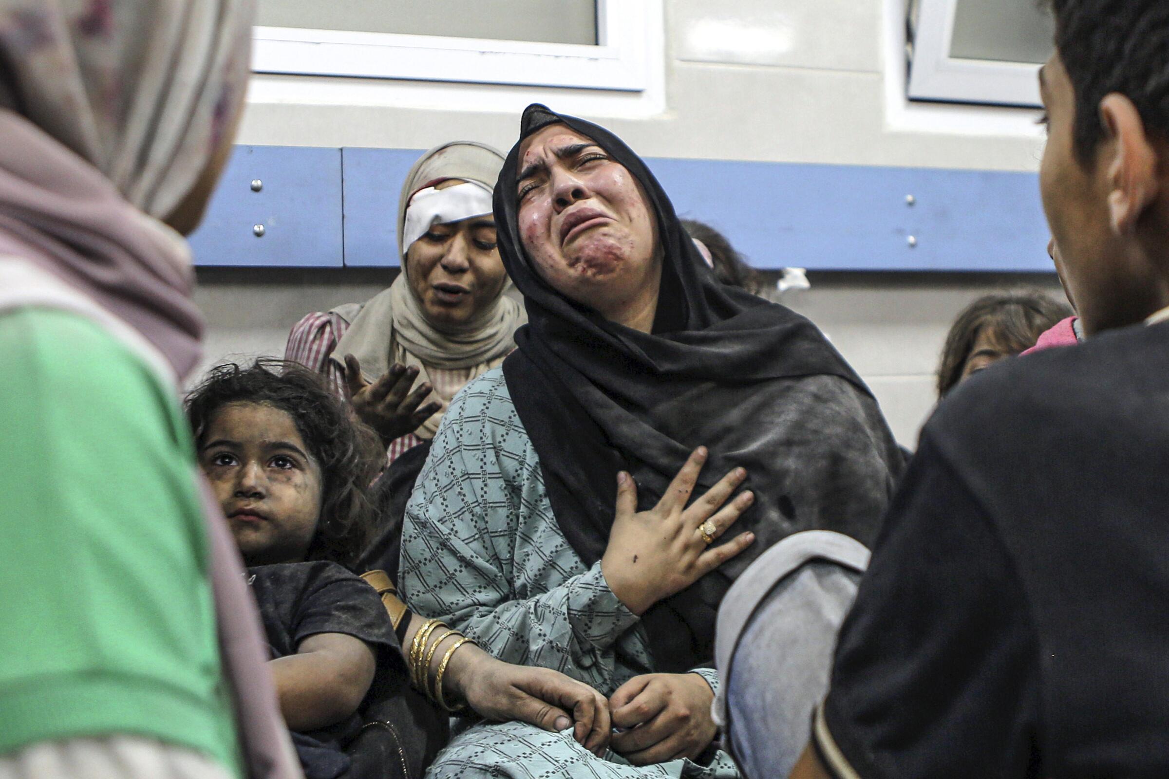 Wounded Palestinians Ahli Arab hospital at the al-Shifa hospital, following Israeli airstrikes, in Gaza City