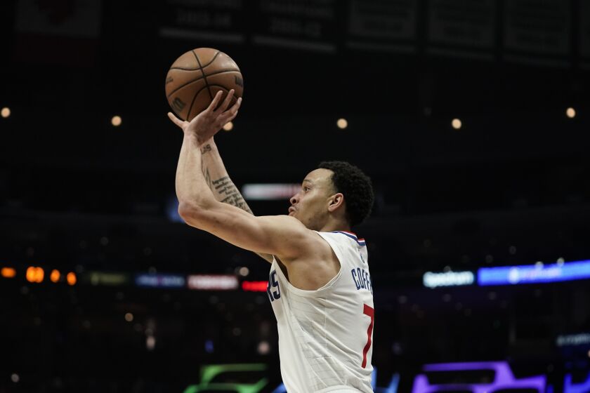 Los Angeles Clippers' Amir Coffey shoots for a three-point basket during second half of an NBA basketball game against the Los Angeles Clippers Sunday, Jan. 9, 2022, in Los Angeles. (AP Photo/Jae C. Hong)