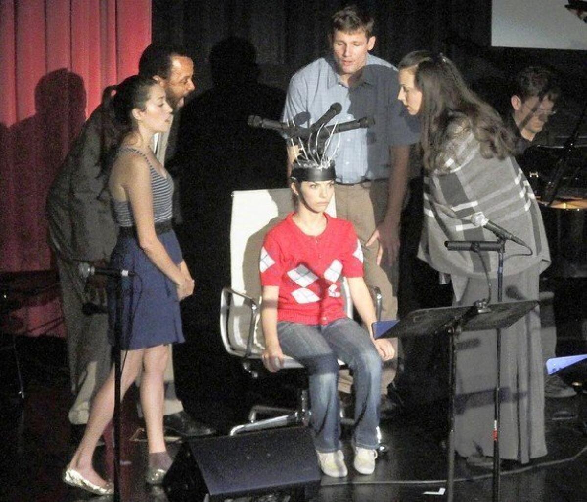 Singers Maria Elena Altany, left, Paul Outlaw, Ariel Downs (red, sitting), Cale Olson and Peabody Southwell singing in the opera "The House is Open" by Alexander Vassos during its performance at First Take, six operas-in-progress performed at the Hammer Museum in West Los Angeles.