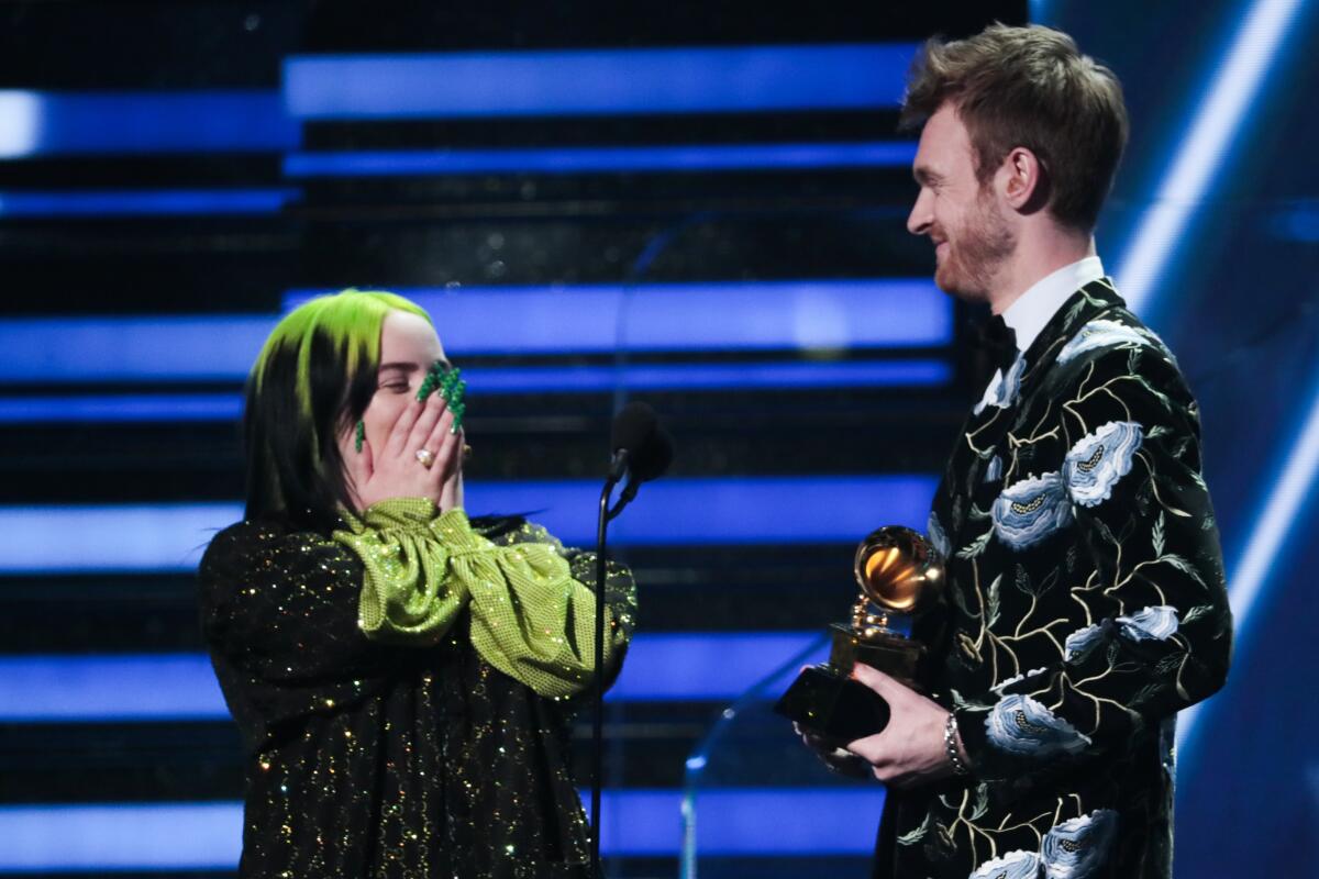 Billie Eilish and Finneas O'Connell accept their award for song of the year at the 62nd Grammy Awards. 