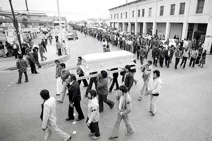 Pallbearers carry Rufino Contreras' casket through Calexico, Calif., on Feb. 14, 1979, leading a crowd of 7,000 mourners who walked three miles to the cemetery. Contreras had been gunned down four days earlier when he and others went into the fields to try to persuade strike-breakers to stop working.