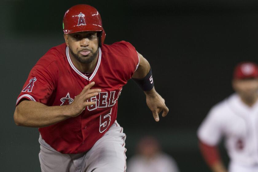 Angels slugger Albert Pujols runs to third base during the team's comeback victory over the Washington Nationals on Monday.