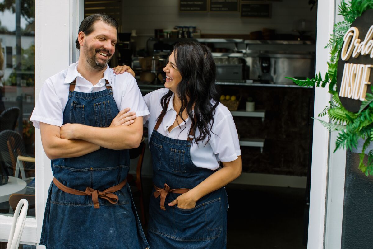 Jamie and Marie Brawn in the doorway of their newly opened cafe Homestead in Solana Beach.