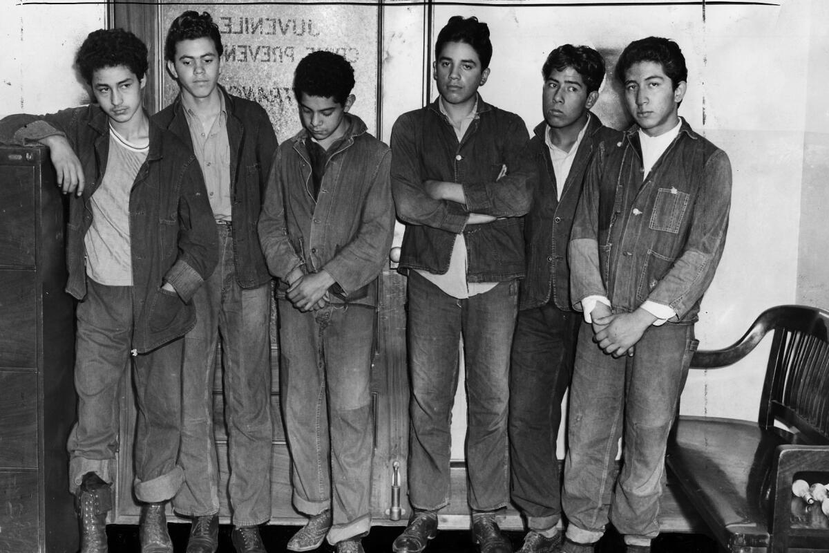 Suspects - Six more of twenty held are Joe Jiminez, 16, A. R. Galind, 17, R. R. Reveles, 16, Oscar Moreno, 16, Martin P. Garcia, 17, Frank Soto, 17, in row, left to right,(Date stamp on back of photo says publication date Aug. 4, 1942 ) (NOTE: * Jiminez and Galind were spelled like that in caption.)