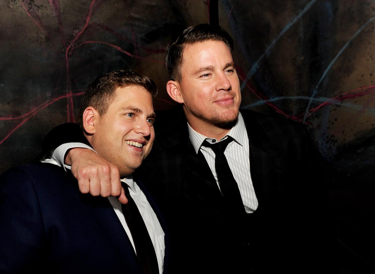 Jonah Hill, left, and Channing Tatum pose at the after-party for the premiere of "22 Jump Street."