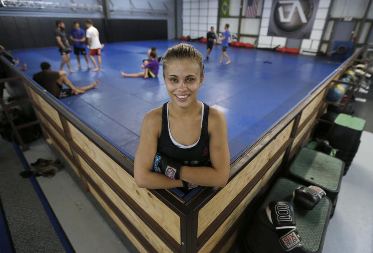 Paige VanZant pauses after a workout at the Ultimate Fitness gym in Sacramento on April 13, 2015.