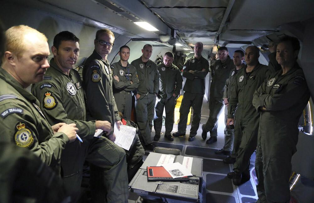 A Royal New Zealand Air Force P3 Orion crew has a briefing prior to departing for the search area to help find the missing Malaysia Airlines Flight MH370 on March 31.