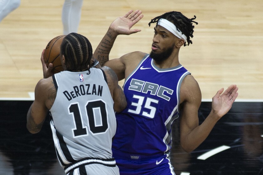San Antonio Spurs forward DeMar DeRozan (10) is fouled by Sacramento Kings forward Marvin Bagley III (35) during the second half of an NBA basketball game in Sacramento, Calif., Friday, May 7, 2021. (AP Photo/Hector Amezcua)