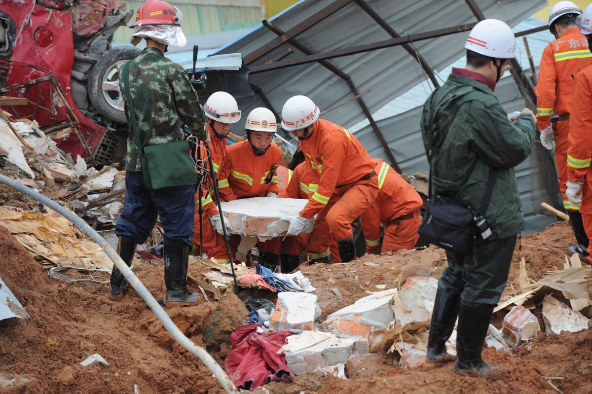 Rescue workers look for survivors after a landslide hit an industrial park in Shenzhen in south China's Guangdong province.