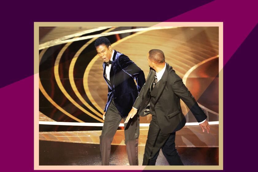 Will Smith slaps Chris Rock onstage during the show at the 94th Academy Awards.