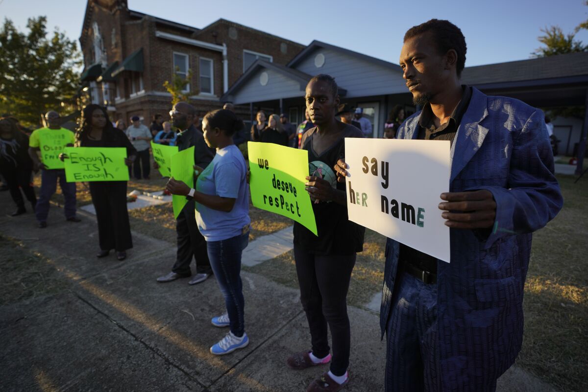 Protesters gather on Sunday outside the house where Atatiana Jefferson was killed by police in Forth Worth.