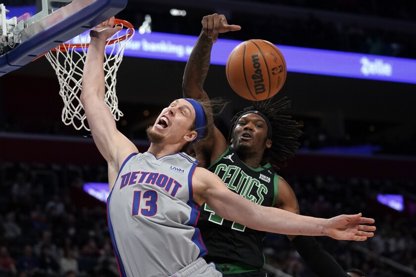 Boston Celtics center Robert Williams III (44) blocks a Detroit Pistons forward Kelly Olynyk (13) shot in the second half of an NBA basketball game in Detroit, Friday, Feb. 4, 2022. (AP Photo/Paul Sancya)