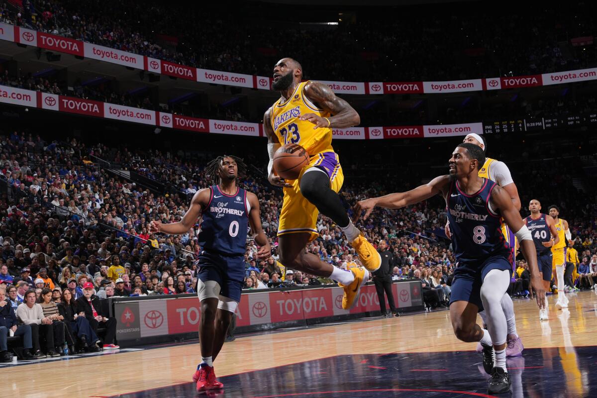 Lakers star LeBron James drives to the basket during a 138-94 loss to the Philadelphia 76ers on Monday night.
