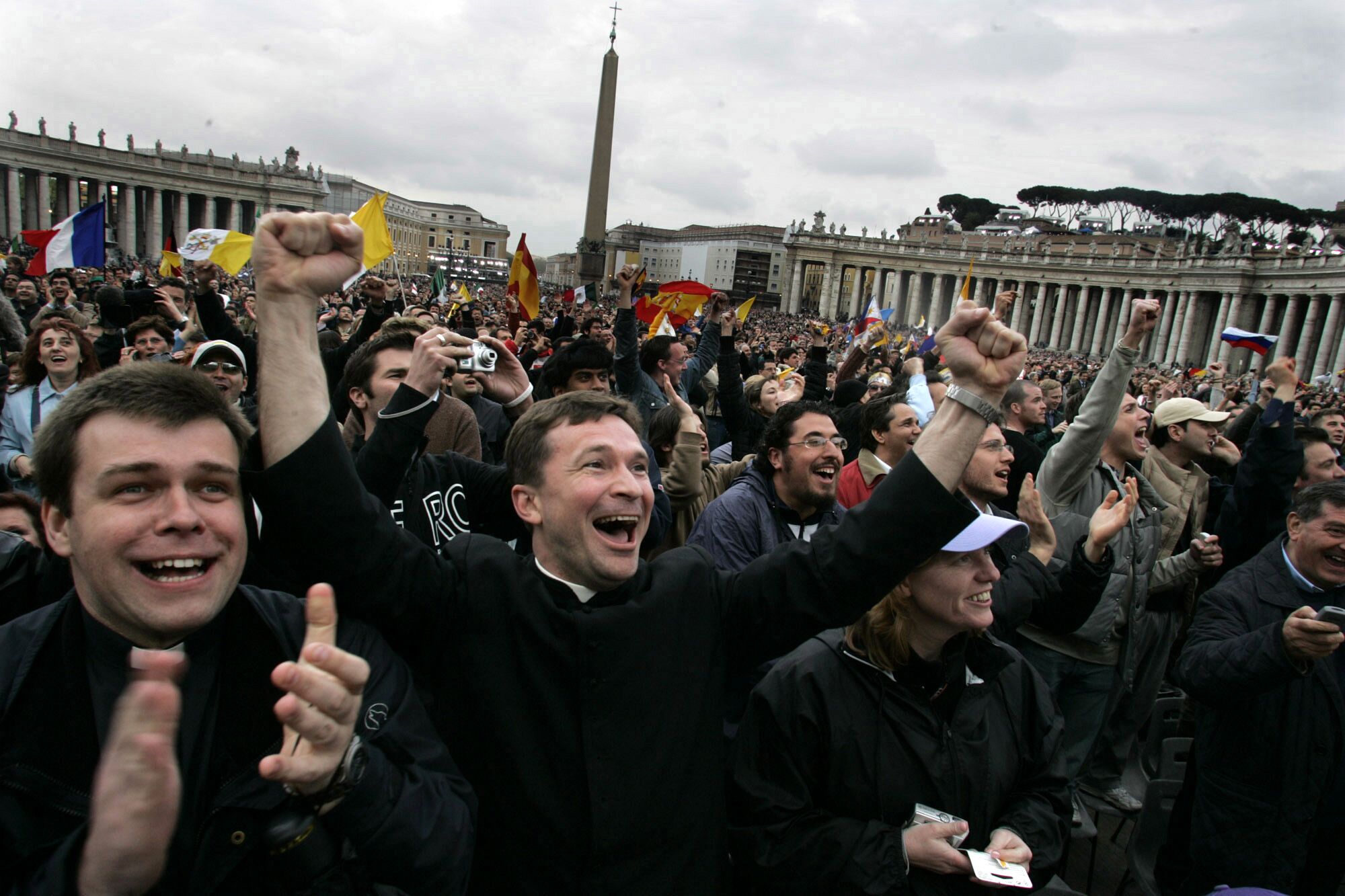 People in St Peter's Square celebrate announcement of new pope.
