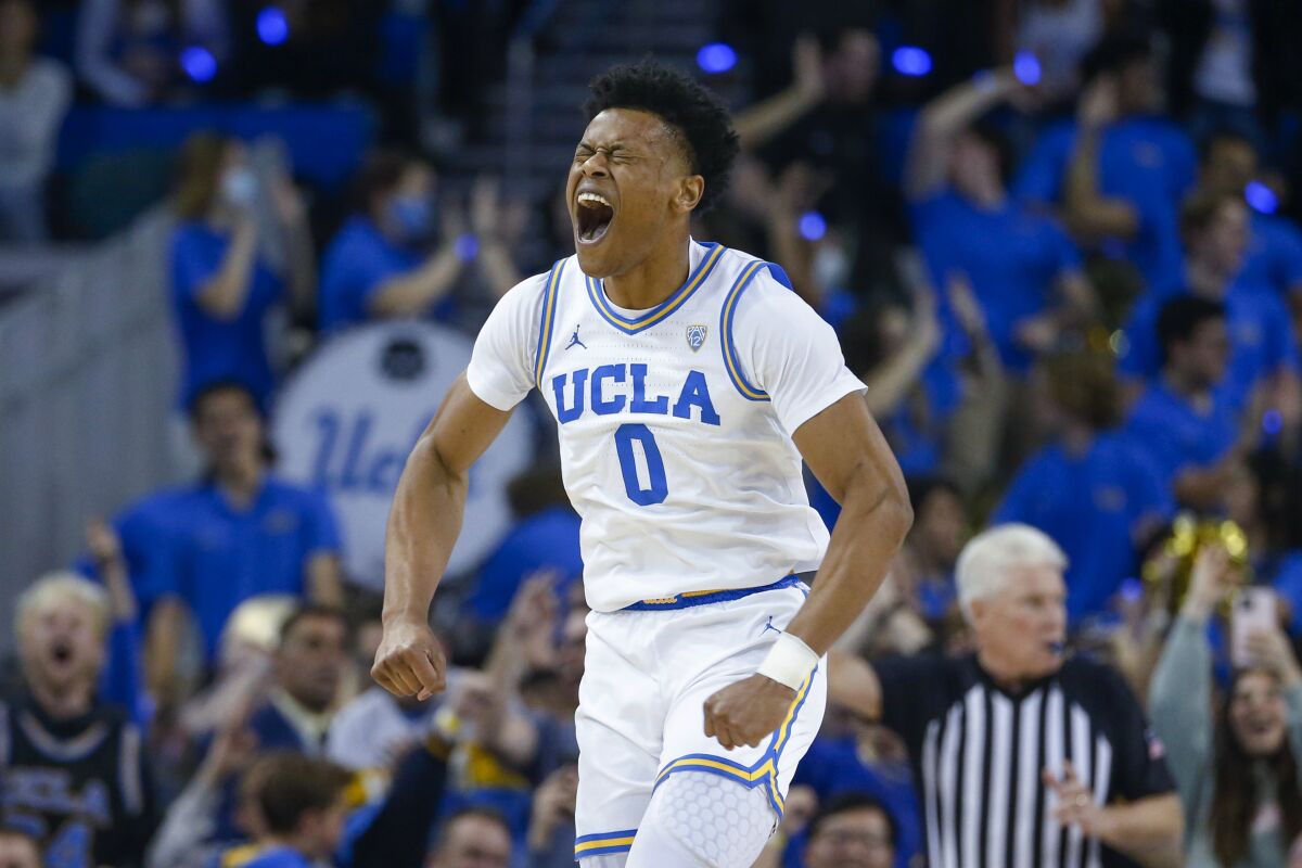 Bruins guard Jaylen Clark is fired up after making a three-pointer March 4, 2023.