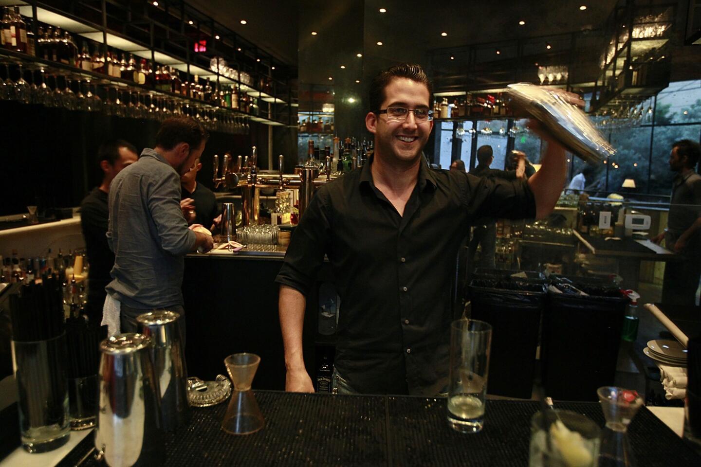 Laurel Hardware bartender Cole Apodaca mixes a drink.