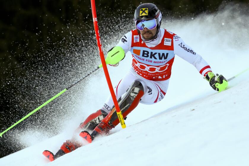 FILE - Austria's Marcel Hirscher speeds down the course during an alpine ski, men's World Cup slalom in Wengen, Switzerland, Sunday, Jan. 14, 2018. Marcel Hirscher, one of the most successful ski racers of all time, is planning to return next season after five years in retirement. And the record eight-time overall World Cup champion is going to compete for the Netherlands — his mother's country — instead of his native Austria. (AP Photo/Alessandro Trovati, File)